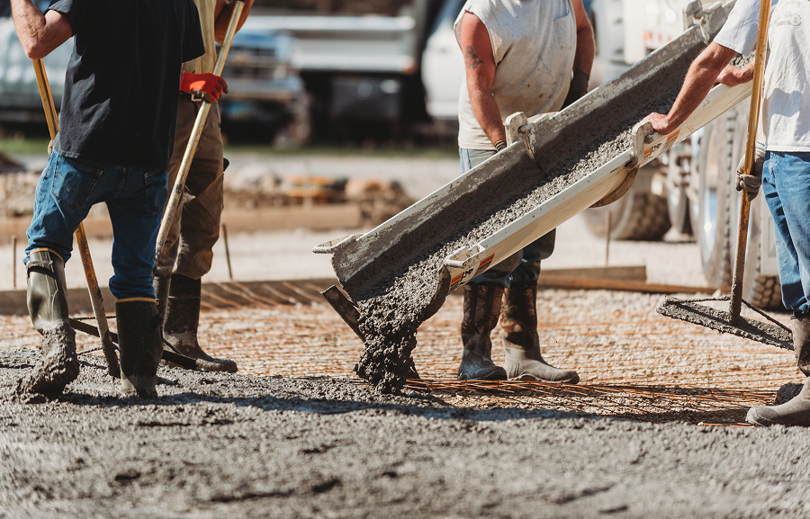 Workers pouring cement