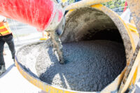 Cement being poured into a funnel